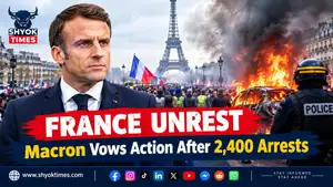 France unrest in Paris after protests, showing damaged streets and a burnt-out vehicle.