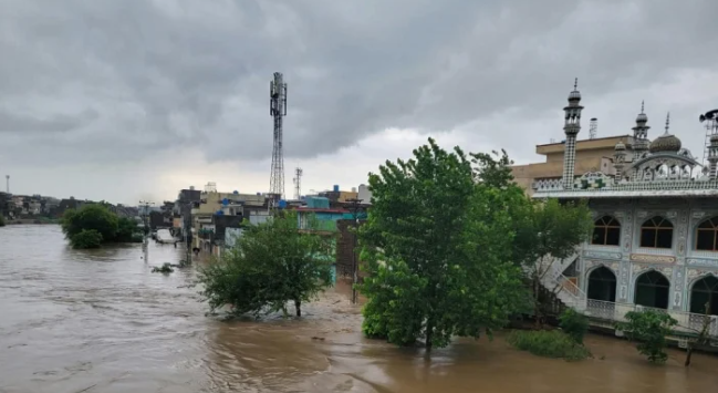 Flooded streets in Rawalpindi after heavy rainfall as rescue teams monitor rising water levels in Nullah Lai