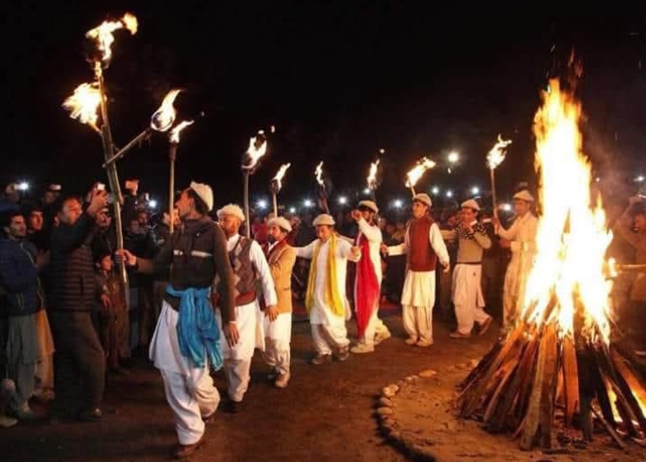 Balti men in traditional attire performing synchronised folk dance during Losar festival in Skardu