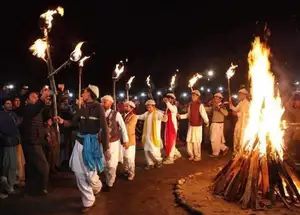Balti men in traditional attire performing synchronised folk dance during Losar festival in Skardu